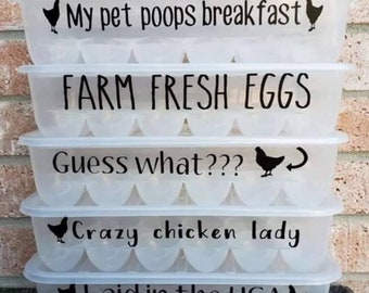 May include: Stack of clear plastic egg cartons with black text and chicken silhouettes. The text includes phrases like "My pet poops breakfast," "Farm Fresh Eggs," and "Laid in the USA."
