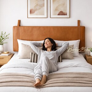 May include: A handmade wooden sign with the word "Welcome" in a whimsical font. The sign has a distressed white background and a dark brown frame, ideal for a front door or hallway. The sign measures approximately 30 cm wide and 15 cm tall.