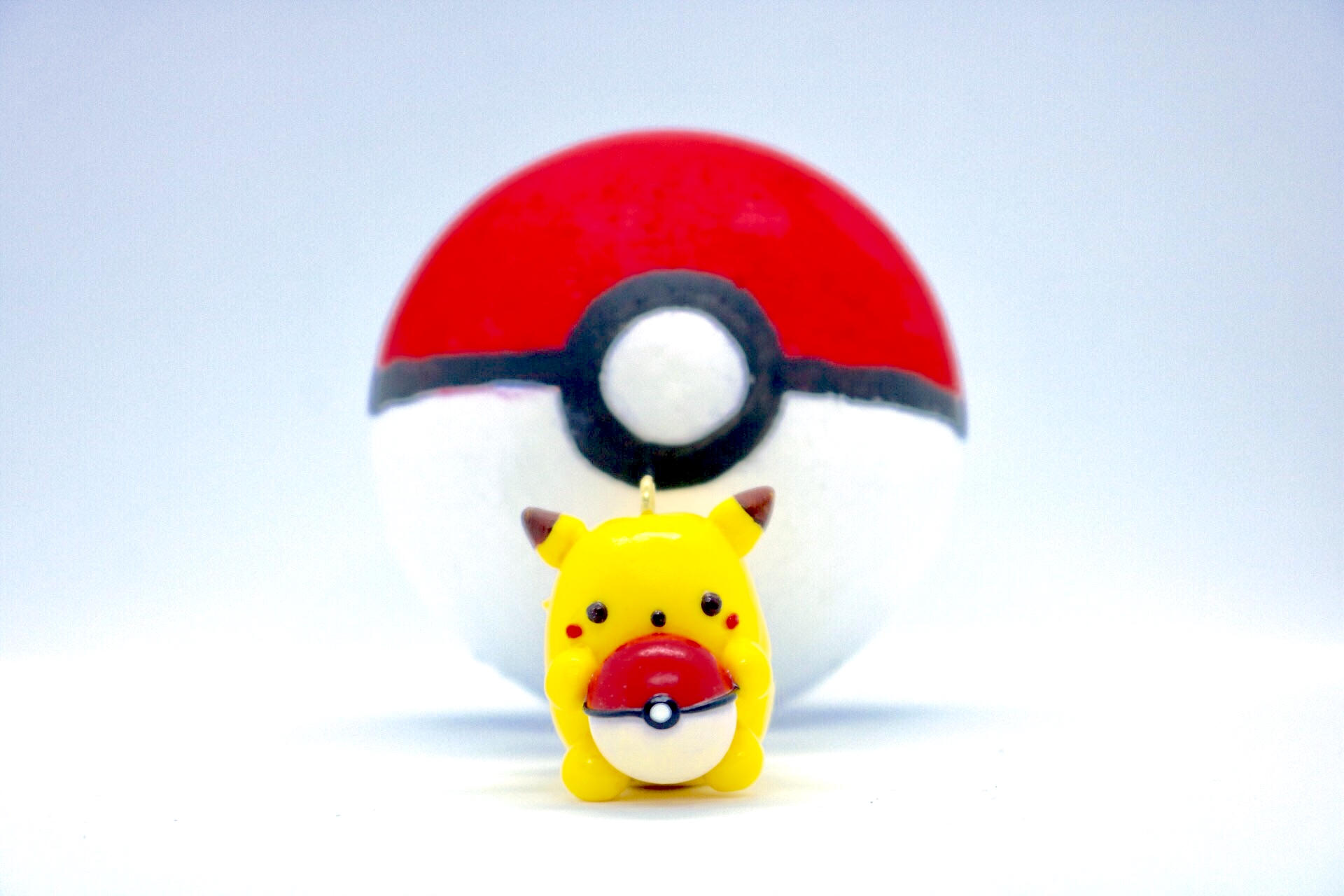 Cute Pikachu holding pokeball charm Etsy