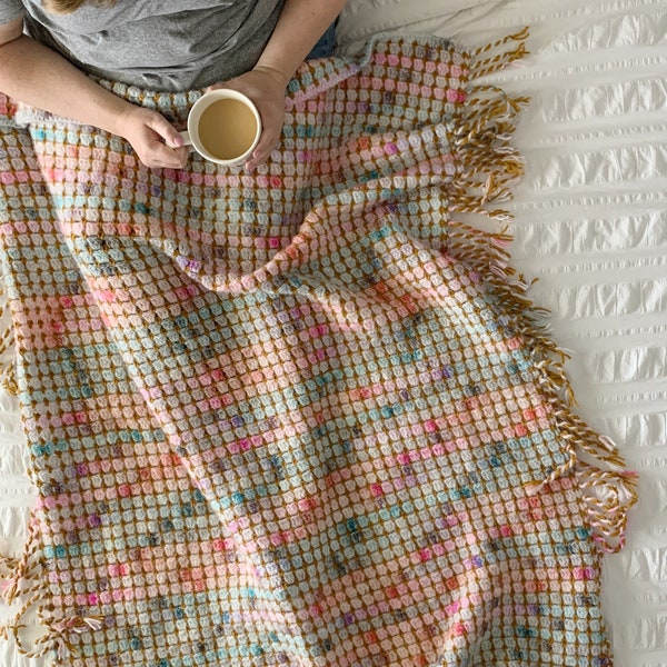 colorful crochet blanket pattern with twisted fringe, easy crochet blanket with no ends to weave in, The Magnus Throw crochet pattern