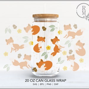 May include: A 20 ounce glass can wrap featuring a pattern of orange and white foxes with brown acorns and yellow flowers. The text "20 OZ CAN GLASS WRAP" is printed below the image. The text "SVG | EPS | PNG | DXF" is printed below the text.