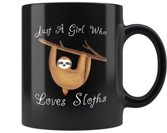 May include: Black ceramic coffee mug with a white graphic of a sloth hanging from a branch. The text "Just A Girl Who Loves Sloths" is printed on the mug.