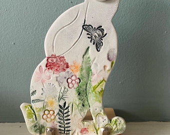 Handmade 2-d ceramic moon gazing hare decoration ( wildflowers and bee) on a stand