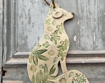 Handmade hanging 2-d ceramic sitting fox decoration (leaves)