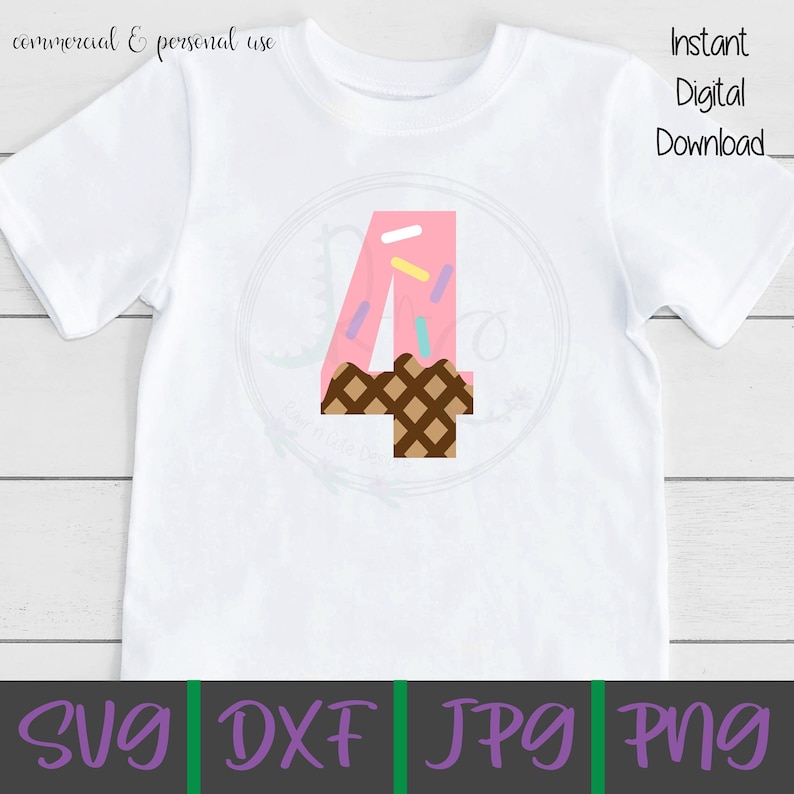 May include: A white t-shirt with a pink number four on it. The number four is decorated with sprinkles and a brown waffle cone.