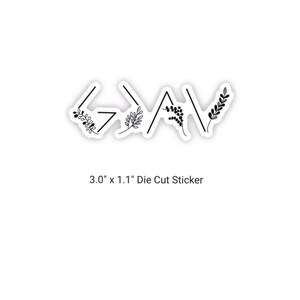 May include: Black and white die-cut sticker with the word "God" in a stylised font with floral accents. The sticker measures 7.6 cm by 2.8 cm.