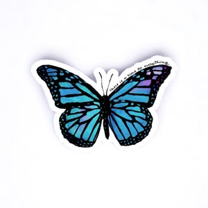 May include: A blue butterfly sticker with the text "There is a time for everything" printed on it.