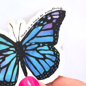 May include: A blue and purple butterfly sticker with the text "there is a time for everything".