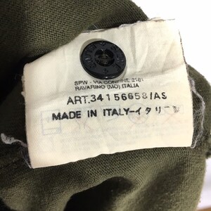 May include: A white tag with black text on a green fabric background. The tag reads "SPW - VIA CONWINE 201 RAVARINO (MO) ITALIA ART.341 56658/AS MADE IN ITALY-イタリー".