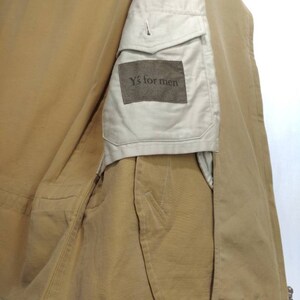 May include: A brown and beige jacket with a patch on the sleeve that says "Y's for men".