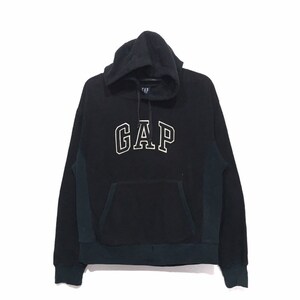 May include: Black hooded sweatshirt with a white "GAP" logo on the front. The sweatshirt has a kangaroo pocket and a drawstring hood.