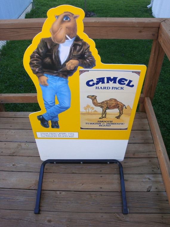 joe camel cigarette pack Camel, The Mascot for Cigarettes (1974-1997) Created by French artist Nicholas Price in 1974, Joe Camel was the face of the tobacco company. It wasn't until 1988 when the advertising Joe Camel - Wikipedia