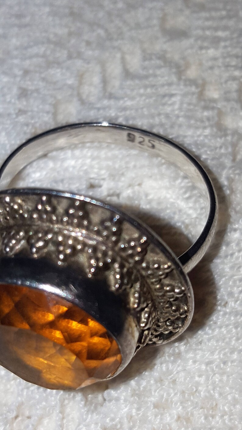 Vintage lab created Topaz ring set in 925 sterling silver.