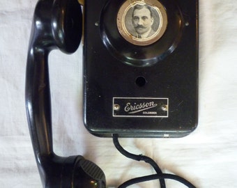 Old wall telephone early 20th century Ericsson brand in Bakelite -Antique early 20th century Ericsson telephone in Bakelite.
