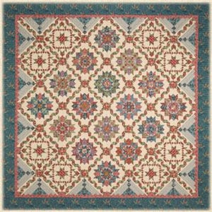 May include: A detailed quilt with a repeating floral and star pattern in shades of red, blue, green, and cream. The quilt is framed by a teal border with a floral design. The text "A Ribbon Runs Through It" is at the top, and "Sew'n Wild Oaks" is at the bottom.