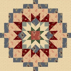 Op de afbeelding: Een quiltblok met een stervormig ontwerp in tinten rood, groen, blauw en cr&egrave;me. De ster is omgeven door kleinere vierkanten en driehoeken in een herhalend patroon.