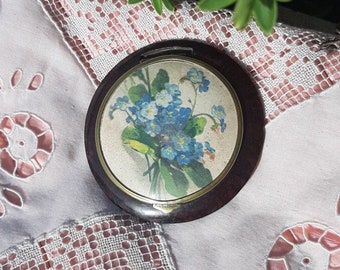poudrier de poche décor de fleurs bleues bakélite et laiton poudrier miroir art déco années 1920