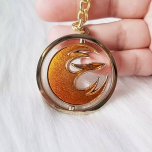 Sabine&#39;s Starbird double sided spinning keychain | hard enamel