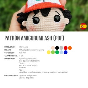 May include: A crocheted amigurumi doll of a character with black hair, large black eyes, and a red and white hat. The doll is approximately 16 cm tall. The pattern is titled "PATR&Oacute;N AMIGURUMI ASH (PDF)".