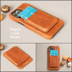 May include: A brown leather phone case with a built-in card holder. The case has a magnetic closure and is designed to hold credit cards or other small items. The text "Magnet Card Holder" is printed on the case.