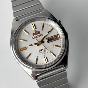 Orient AAA Automatic. Modell LH L469711. Vintage Original Japan Elegant Mekanisk Armbandsur. 1990-talet