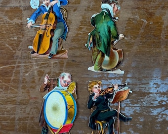 Lot de 4 découpes pour scrapbooking sur le thème des musiciens, idéal pour les carnets de voyage et les techniques mixtes. Papier vintage victorien découpé.