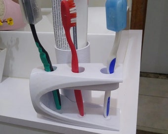 Tooth brush paste holder