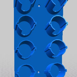 May include: Blue wall-mounted organizer with eight round slots for storing items.