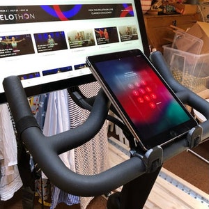 Spinning bike cellphone, tablet, or laptop holder