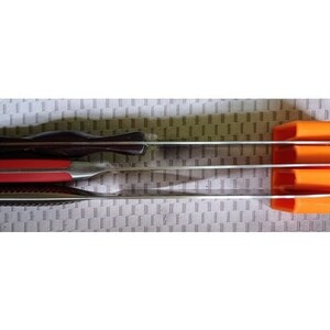 May include: A set of four orange knife holders mounted on a wall, with three knives inserted. The knives are stainless steel with black and red handles.