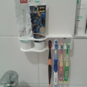 Toothbrush and toothpaste holder