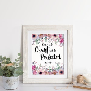 May include: A framed print with a floral design and the text "Come unto Christ and be Perfected in Him.  Romans 15:13"