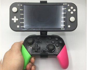 Staffa Per Controller Nintendo Switch/Lite - Morsetto Per Gamepad, Leggero E Portatile - Foto 2