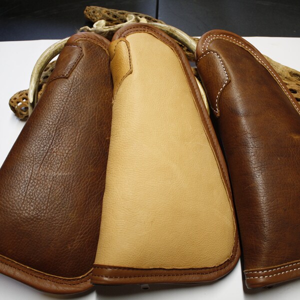 Buffalo and various cowhide leather pistol cases/rugs