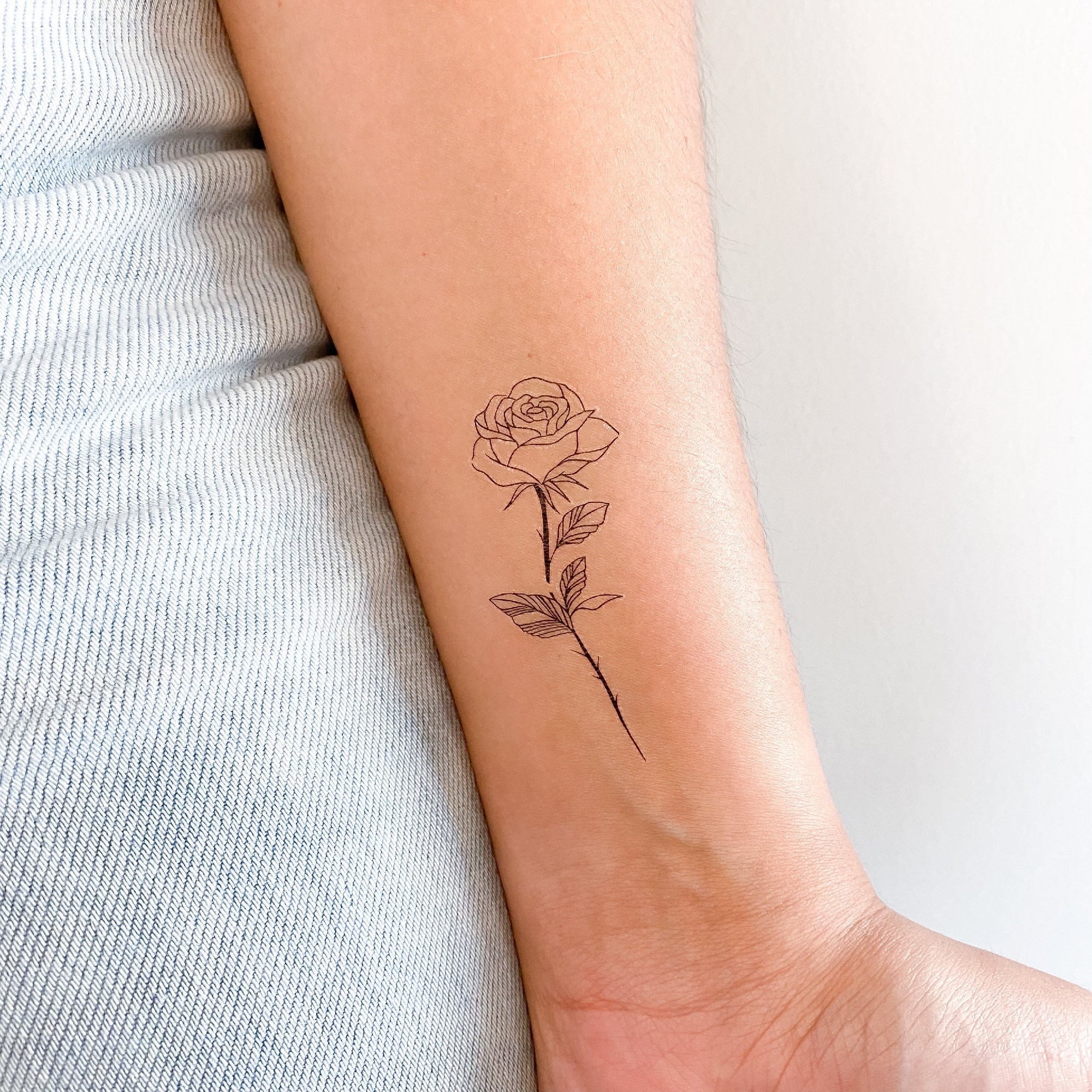 Minimalist Rose Tattoo with Fine Lines