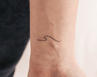 May include: A simple black line drawing of a wave on a person's wrist.