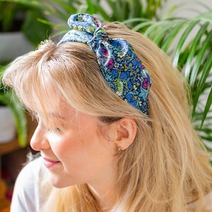 A woman wearing a Liberty London print side bow headband | Holme & Moss