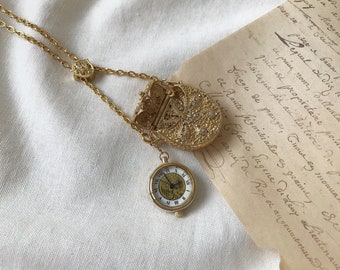 BELAMI Montre à pendentif en métal doré et strass avec collier porte-monnaie et chaîne, montre à quartz, montre japonaise, collier montre classique