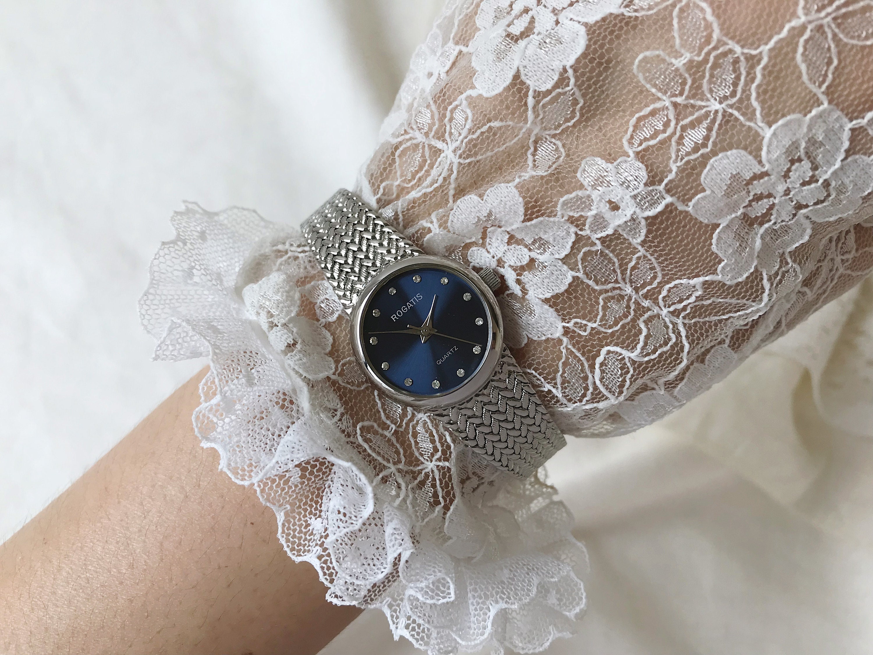 ROGATIS シルバートーンメタルとブルーダイヤルレディースブレスレット