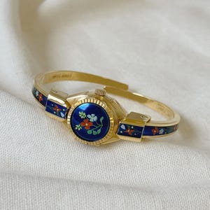 R.Müller Geneve Gold Tone Metal And Enamel Women Watch With Floral Design, Swiss Made, Quartz Movement, Cuff Bangle Watch, Peek A Boo Watch