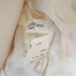 May include: A white fabric label with the text "Creges Paris" and "100%" printed on it. The label also has the text "S0T1 C-OS-168" printed on it.