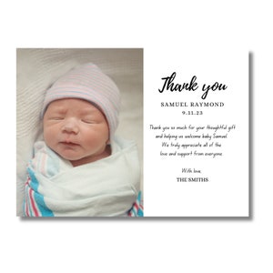 May include: Thank you card with a photo of a newborn baby wearing a pink and blue striped hat. The card reads "Thank you" with the baby's name, Samuel Raymond, and the date 9.11.23. The card also includes a message thanking the recipient for their thoughtful gift and support.