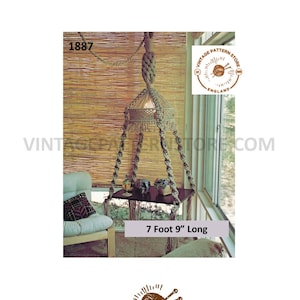 May include: A macrame plant hanger with a wooden shelf, suspended from a rope. The shelf holds decorative items. The text "7 Foot 9" Long" is visible, which is approximately 236 cm. The image also includes the text "VINTAGE PATTERN STORE ENGLAND".