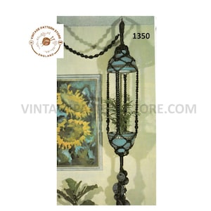 May include: A vintage macrame plant hanger with a turquoise pot. The plant hanger is suspended from a chain and features a beaded design. The image includes the text "1350" and the logo for Vintage Pattern Store England.
