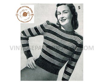May include: A black and white striped sweater with a crew neck. The sweater is being modeled by a woman with dark hair. The image includes the text "VINTAGE PATTERN STORE ENGLAND" and "EST (2008)".