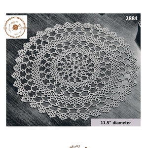 May include: Vintage crochet doily pattern, number 2884, with a 11.5 inch diameter. The pattern is intricate and delicate, with a circular design.
