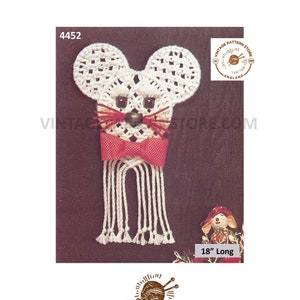 May include: A handmade white crochet mouse with a red bow tie and whiskers. The mouse has black bead eyes and a brown bead nose. The mouse is approximately 18 inches long. The image includes the text "Vintage Pattern Store England".