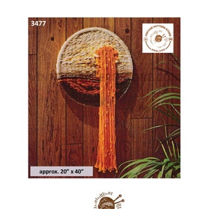 May include: A vintage knitting pattern for a wall hanging with a sunset design. The pattern is approximately 20 inches by 40 inches. The pattern is from Vintage Pattern Store, England.