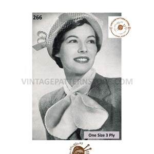 May include: Vintage knitting pattern for a white scarf with a bow. The pattern is for one size and uses 3 ply yarn. The pattern is from Vintage Pattern Store, England.