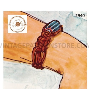 May include: A brown leather bracelet with a blue and white patterned charm. The bracelet is tied in a knot and has a simple design.